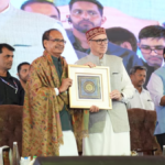 Shivraj Singh Chouhan and Omar Abdullah hold a framed memento at a government event in Srinagar for J&K road projects.