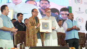 Shivraj Singh Chouhan and Omar Abdullah hold a framed memento at a government event in Srinagar for J&K road projects.