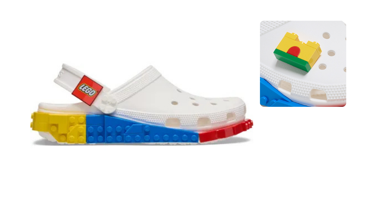 Close-up of the white LEGO Masterbrand Creativity Clog featuring a red, blue, and yellow LEGO brick midsole and a yellow brick Jibbitz charm.