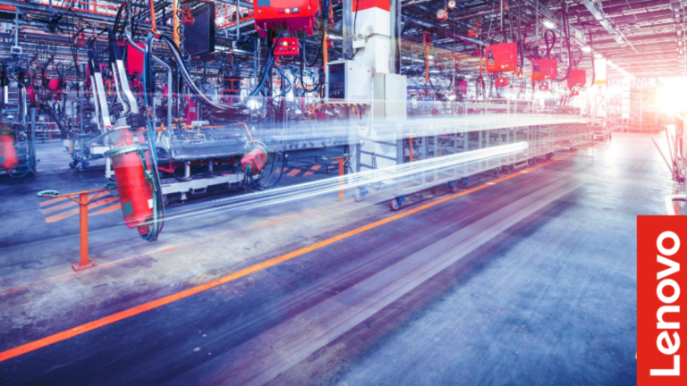 Factory assembly line with red machinery and blurred light trails featuring a Lenovo logo for India AI manufacturing