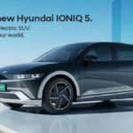 Titan Grey Hyundai IONIQ 5 EV with green Indian number plate in a futuristic architectural setting for launch.