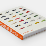 A perspective shot of the 'Nike Football Boots' hardcover book by Phaidon Press, featuring a grid of iconic cleats on a cl...
