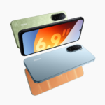 Three REDMI A7 Pro smartphones in Palm Green, Sunset Orange, and Mist Blue showing the massive 6.9-inch immersive display.