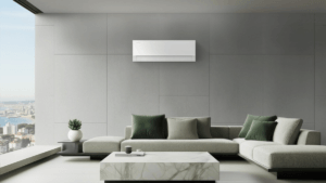 Minimalist white Samsung Bespoke AI WindFree Pro air conditioner wall-mounted above a grey L-shaped sofa in a modern luxur...