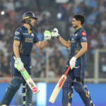 Gujarat Titans captain Shubman Gill and Jos Buttler celebrate with a fist-bump during their successful 181-run chase again...
