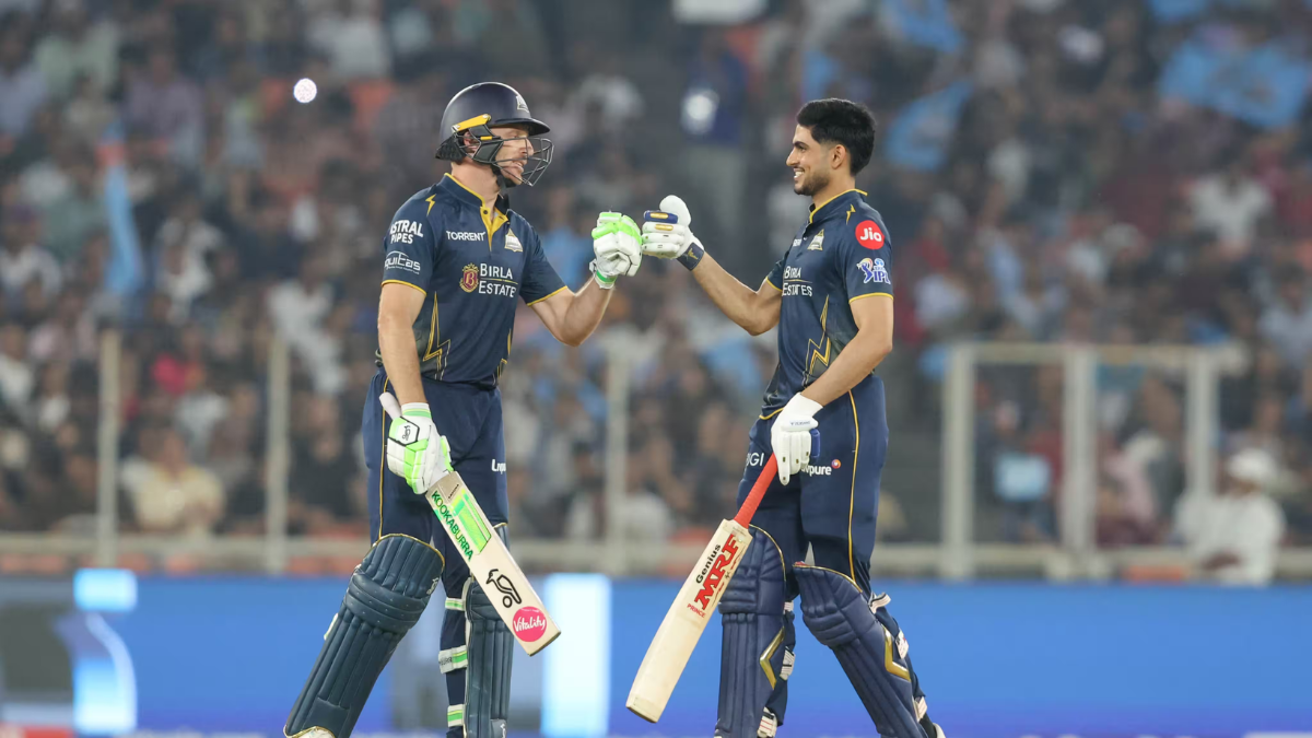 Gujarat Titans captain Shubman Gill and Jos Buttler celebrate with a fist-bump during their successful 181-run chase again...