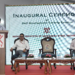 Sandeep Poundrik speaking at a NISST podium during the inauguration ceremony for steel sector training courses in India