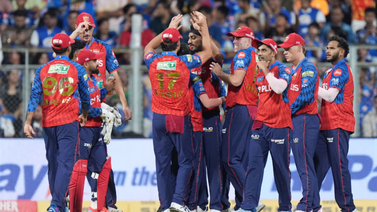 Punjab Kings players including Shreyas Iyer, Arshdeep Singh, and Marcus Stoinis celebrating their seven-wicket victory aga...