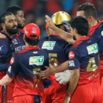 Royal Challengers Bengaluru (RCB) players, including Krunal Pandya and Josh Hazlewood, celebrating a wicket during their T...