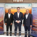 Kamalkanth Tummala of Databricks, Nick Eayrs of Databricks, and Dr. Praveer Sinha of Tata Power standing in front of a ban...