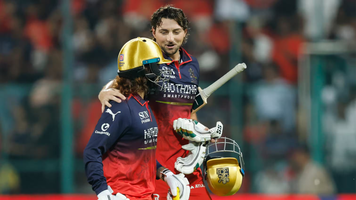 Tim David and Rajat Patidar of Royal Challengers Bengaluru celebrate their record-breaking unbeaten 99-run partnership against Chennai Super Kings at M. Chinnaswamy Stadium.
