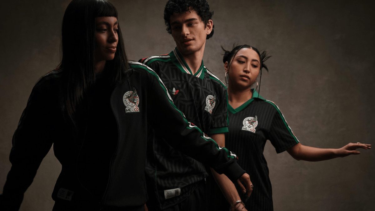 Three models posing in the black adidas Originals Mexico apparel collection featuring traditional green and red striped details.
