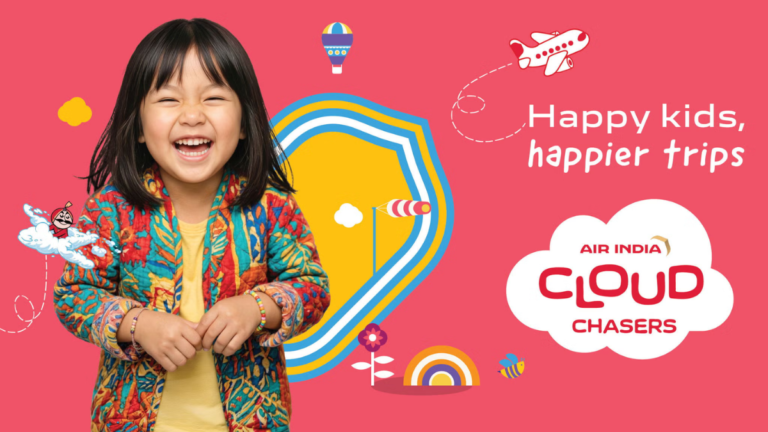 Laughing girl in patterned jacket next to cartoon graphics and the Air India Cloud Chasers logo on pink background.