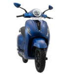 Front view of a matte blue Bajaj Chetak electric scooter with a round LED headlight for the new India C Series launch.