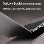 Two Mocha Gray Galaxy Book6 Enterprise Edition laptops showing thin side profiles and ports against a dark business backdrop.