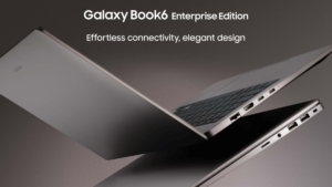 Two Mocha Gray Galaxy Book6 Enterprise Edition laptops showing thin side profiles and ports against a dark business backdrop.
