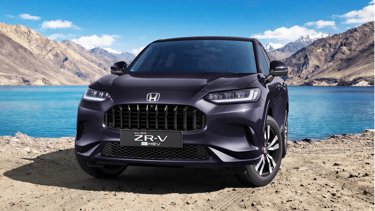The flagship hybrid SUV designed to challenge European dominance 1 A deep purple Honda ZR-V hybrid SUV parked by a blue lake with Himalayan mountains in the background during its India prev...