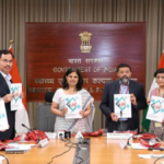 Health officials hold the National Guidelines on Fire and Life Safety documents at the India ministry launch.