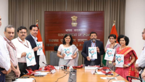 Health officials hold the National Guidelines on Fire and Life Safety documents at the India ministry launch.