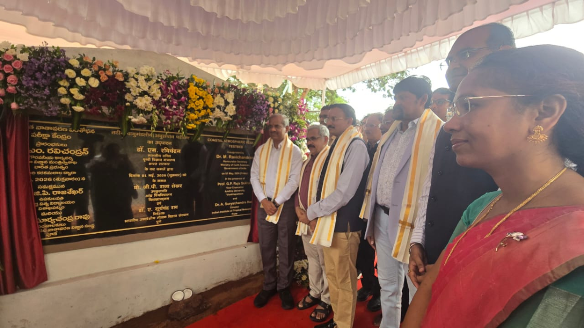 The coastal lab tracking India’s monsoon in real time 1 Officials standing by a flower-adorned inauguration plaque with multilingual text at the Vizag C-ART facility.