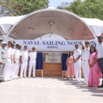 Indian Navy officers and guests stand before the new Naval Sailing Node inauguration plaque at Upper Lake in Bhopal.
