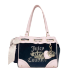 Black and pink Juicy Couture Daydreamer bag with rhinestone crown logo and side bow for its India launch.