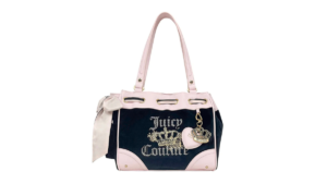 Black and pink Juicy Couture Daydreamer bag with rhinestone crown logo and side bow for its India launch.