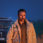 Saif Ali Khan as a bruised officer in a field at night, standing before a police jeep in Kartavya.