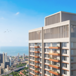 High-rise residential tower with orange balconies overlooking the Mahalaxmi Racecourse and Mumbai sea at BeaconHill
