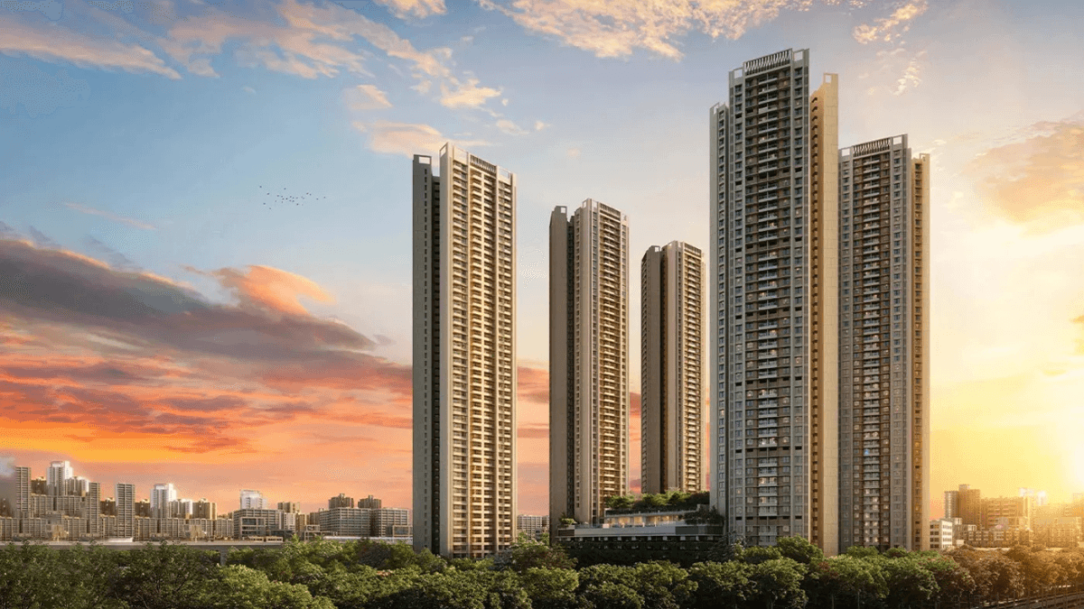 At ₹1.09 crore, this new phase cuts the daily Pune commute 1 High-rise residential towers of Mahindra Citadel in Pune against an orange sunset sky with green trees in the foreground.
