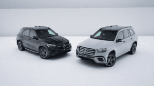 An exterior profile of the black GLE Night Edition and the Alpine Grey GLS Night Edition parked side-by-side in a minimal ...