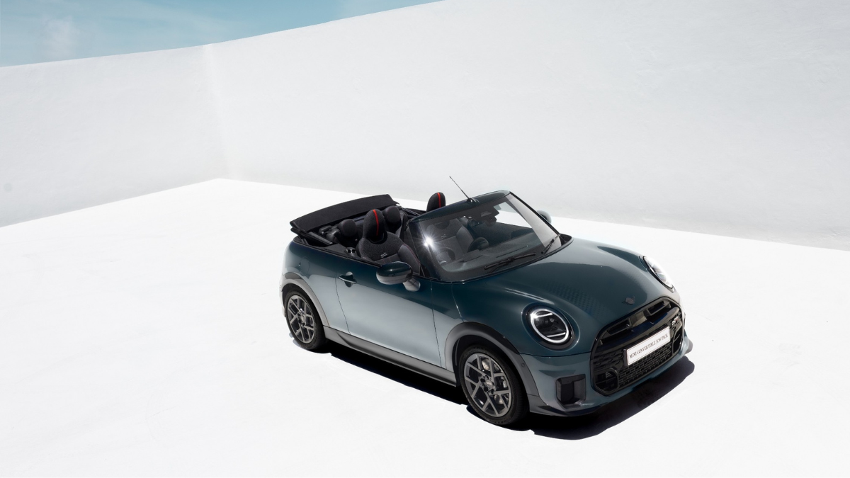 High-angle view of the dark grey MINI Convertible with the roof open, displaying the front grille for the new India model.
