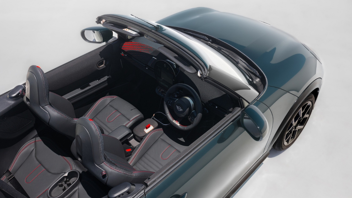 Aerial view of the MINI Convertible black interior showing sports seats and round central display for the India launch.