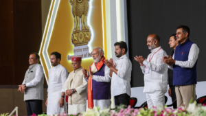 PM Narendra Modi with officials on stage at the PM MITRA Park inauguration event in Warangal Telangana.
