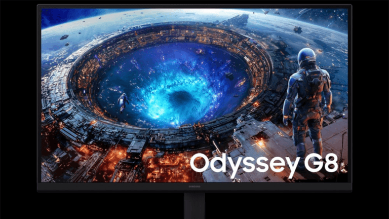 The first 6K gaming monitor arrives with a 330Hz option 1 Front view of a flat Samsung Odyssey G8 desktop monitor displaying a vibrant blue and orange sci-fi space station graphic.