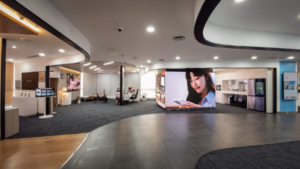 A modern showroom interior with digital displays, appliances, and work zones at the Samsung Business Experience Studio.