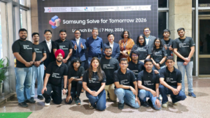 Samsung leadership and IIT Delhi officials standing with students in black t-shirts for the Solve for Tomorrow launch