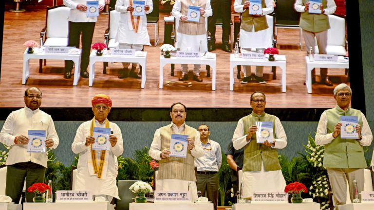 Can India's new SEHAT Mission fix your daily diet 1 JP Nadda and Shivraj Singh Chouhan holding SEHAT Mission booklets on stage at a launch event in Delhi for India nutrition