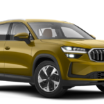 Mustard yellow Skoda Kodiaq 4x4 shown from a front-quarter angle in a studio for the 2026 India launch