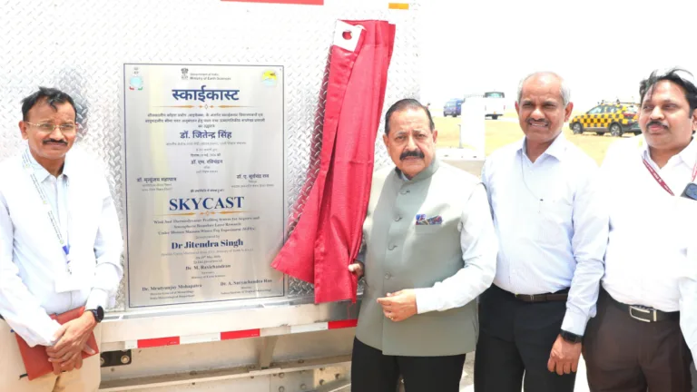 Union Minister Dr. Jitendra Singh unveils the SkyCast plaque with three officials on the Delhi airport tarmac.