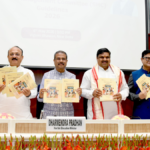 Dharmendra Pradhan and officials holding the SMC Guidelines 2026 booklets at Vigyan Bhawan for the school policy launch.