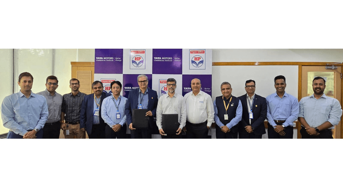4,500 service centres will now recycle your old engine oil 1 Twelve executives from Tata Motors and HPCL standing with a signed MoU in front of a branded backdrop for the recycling pi...