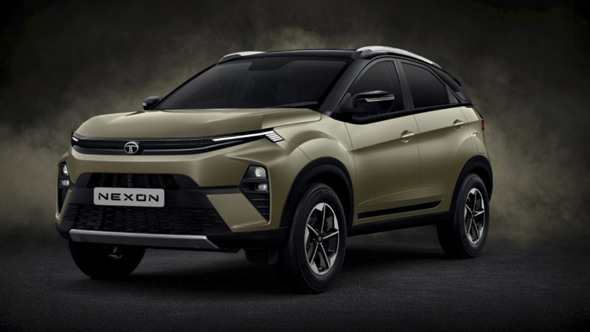 Gold Tata Nexon SUV on a smokey set with black roof and NEXON plate at India launch event
