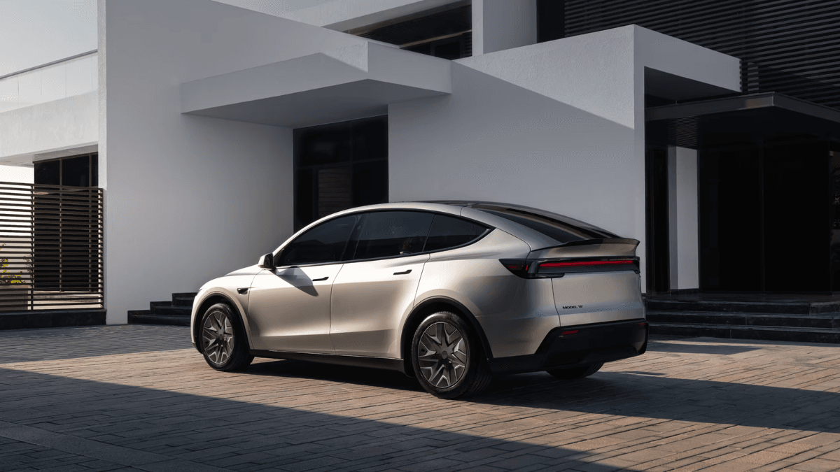 Black minimalist Tesla Model Y dashboard and central touchscreen display showing the cabin layout in India.