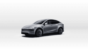 Grey Tesla Model Y crossover parked on a reflective studio floor during the official India launch.