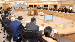 Officials seated at a U-shaped table during the Public Sector Banks review meeting where the unclaimed assets portal launched.