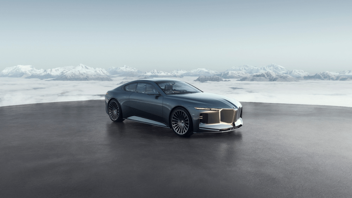 The space between BMW and Rolls Royce is filling 2 Grey Vision BMW ALPINA luxury car on a dark platform overlooking snow-capped Alpine mountains and clouds.