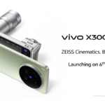 A green smartphone and a silver lens attachment are shown next to text confirming the 6 May India launch.