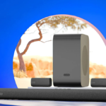 Zebronics 5.1.2 soundbar with two satellite speakers and a large wireless subwoofer on a white platform in India