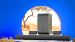Zebronics 5.1.2 soundbar with two satellite speakers and a large wireless subwoofer on a white platform in India